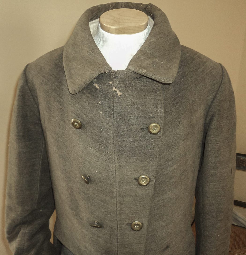 Note the course homespun material and plain brass buttons.