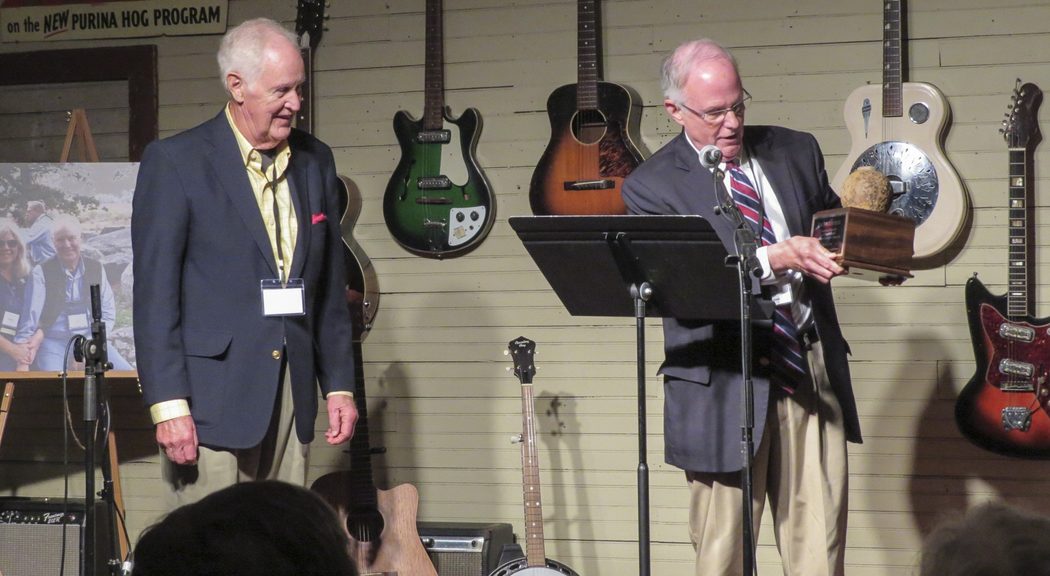 Julian Bibb, founder and board member of Franklin's Charge presents cannon ball to Jim Lighthizer.