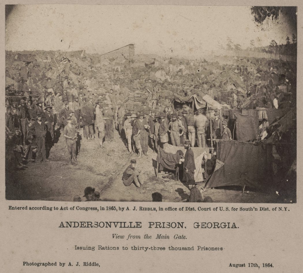 Andersonville Prison. View from the main gate Issuing rations to thirty-three thousand prisoners. Photographed by A.J. Riddle. (Library of Congress)